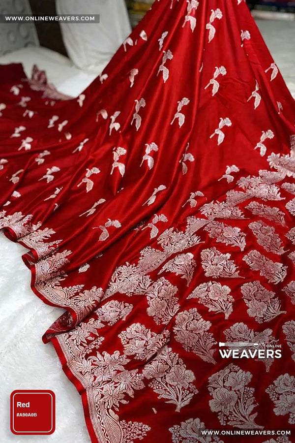 Red Banarasi silk saree with intricate gold zari rose floral woven work, draped elegantly to showcase its border and pattern. "OnlineWeavers' branding