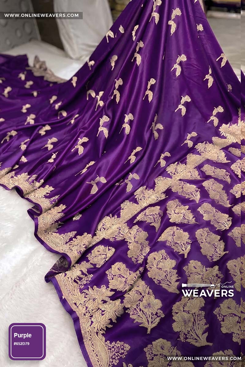 Purple Banarasi silk saree with intricate gold zari rose floral woven work, draped elegantly to showcase its border and pattern. "OnlineWeavers' branding