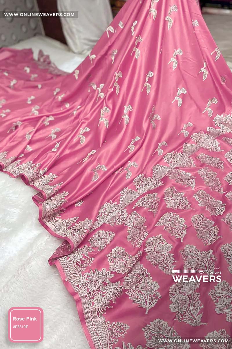 Rose pink Banarasi silk saree with intricate gold zari rose floral woven work, draped elegantly to showcase its border and pattern. "OnlineWeavers' branding