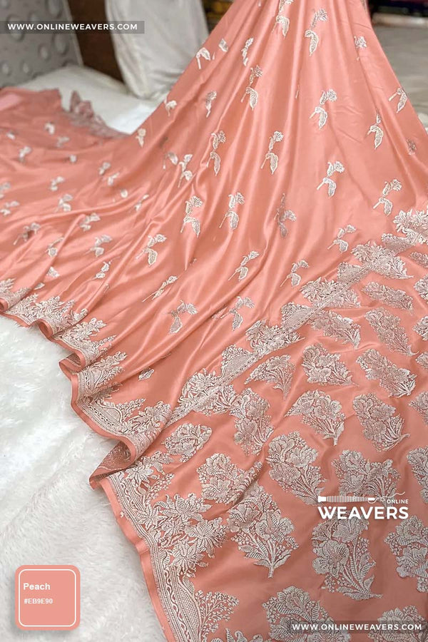 Peach Banarasi silk saree with intricate gold zari rose floral woven work, draped elegantly to showcase its border and pattern. "OnlineWeavers' branding