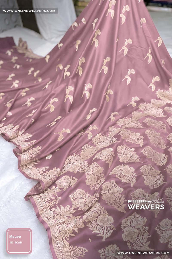 Mauve Pink Banarasi silk saree with intricate gold zari rose floral woven work, draped elegantly to showcase its border and pattern. "OnlineWeavers' branding