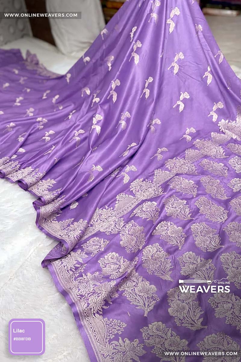 Lilac Purple Banarasi silk saree with intricate gold zari rose floral woven work, draped elegantly to showcase its border and pattern. "OnlineWeavers' branding