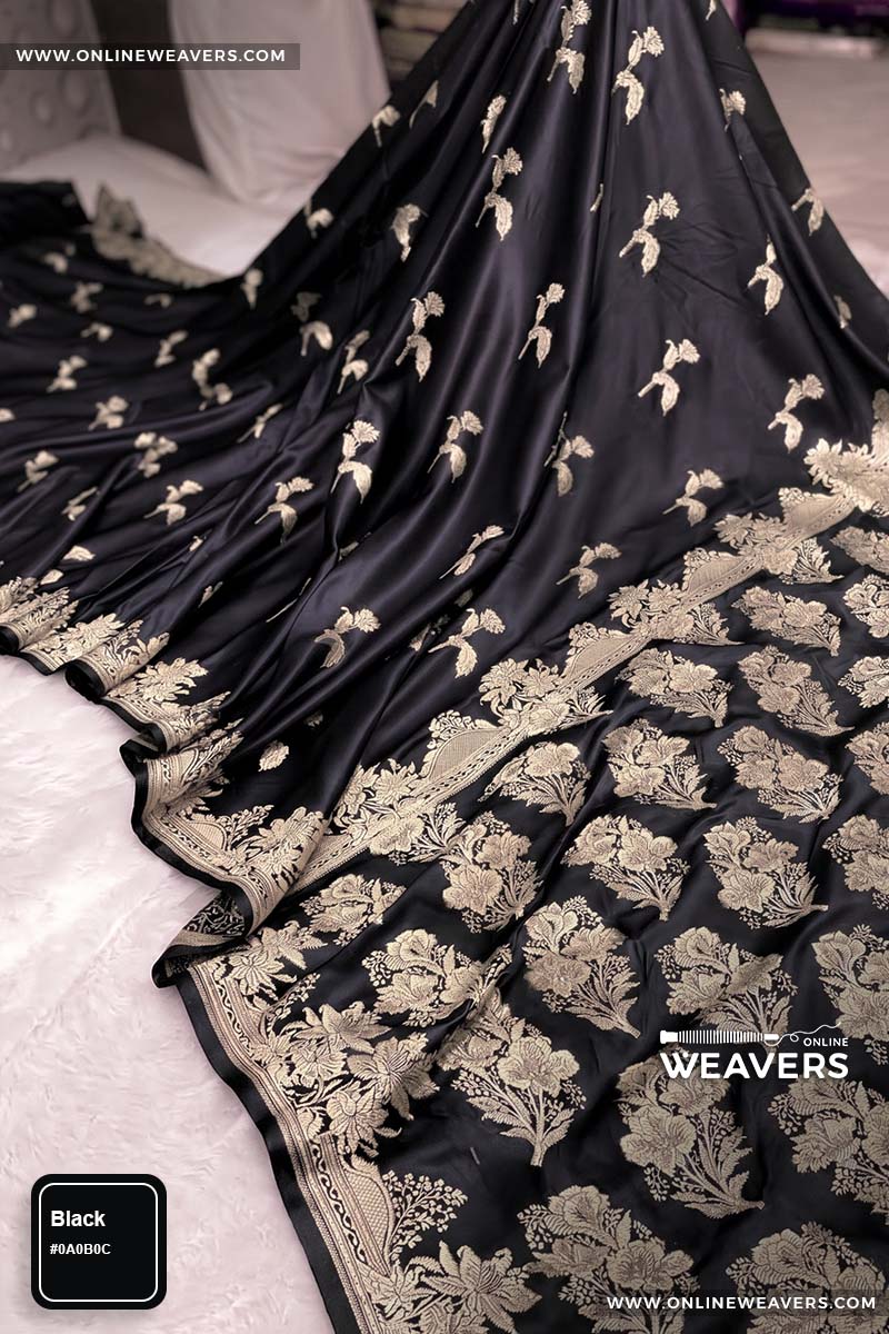 Premium Black Banarasi silk saree with intricate gold zari rose floral woven work, draped elegantly to showcase its border and pattern. "OnlineWeavers' branding
