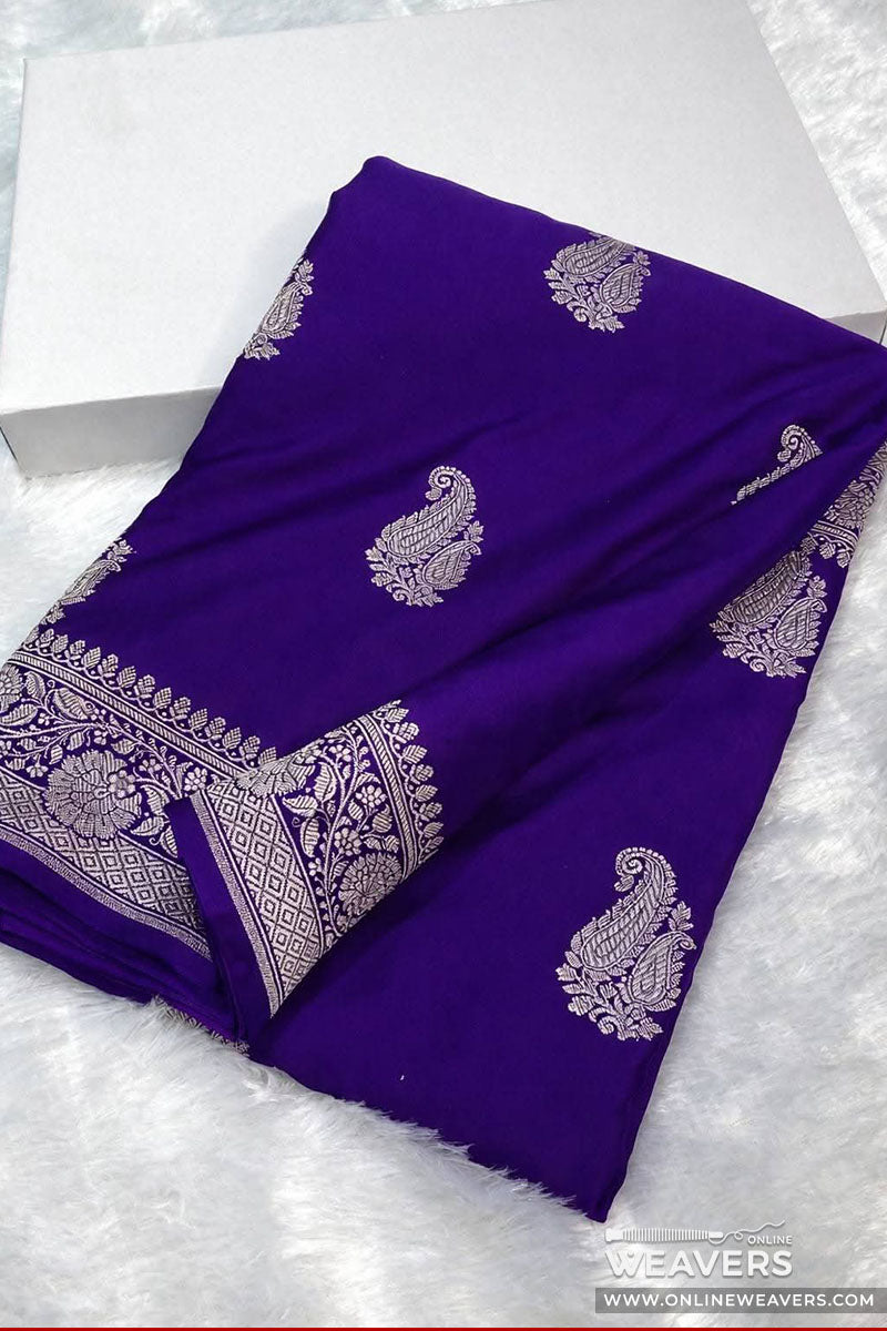 A purple Banarasi silk saree with paisley motifs