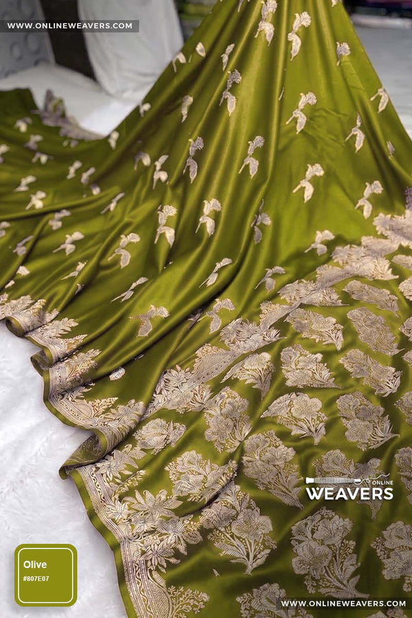 Olive Henna green Banarasi silk saree with intricate gold zari rose floral woven work, draped elegantly to showcase its border and pattern. "OnlineWeavers' branding