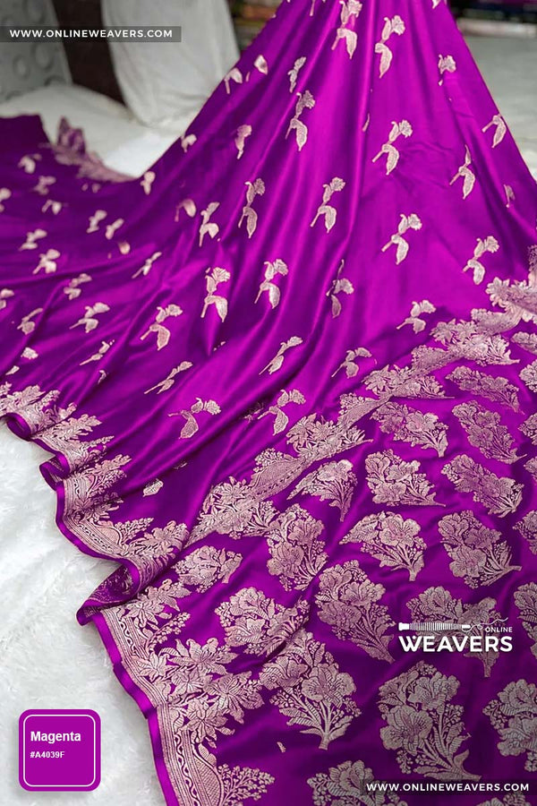 Magenta Pink Banarasi silk saree with intricate gold zari rose floral woven work, draped elegantly to showcase its border and pattern. "OnlineWeavers' branding