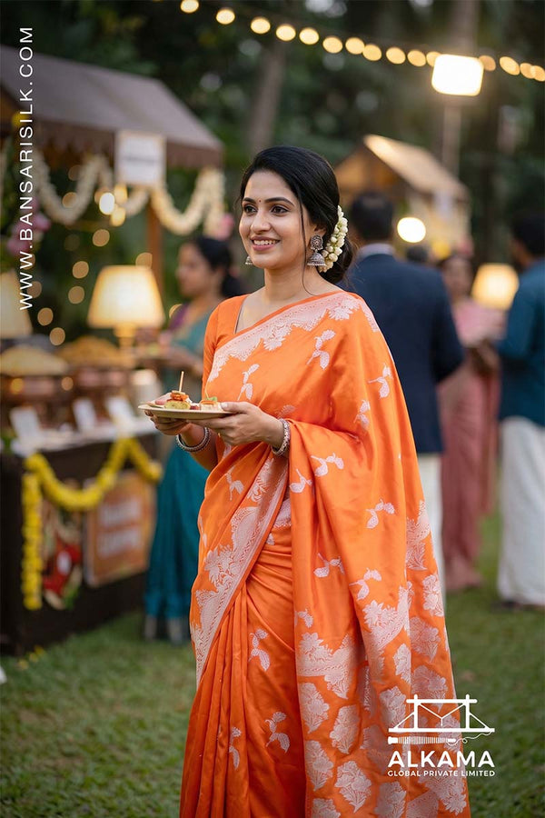 Orange Banarasi Mashru silk saree with 'Varanasi saree Manufacturer weaver' branding