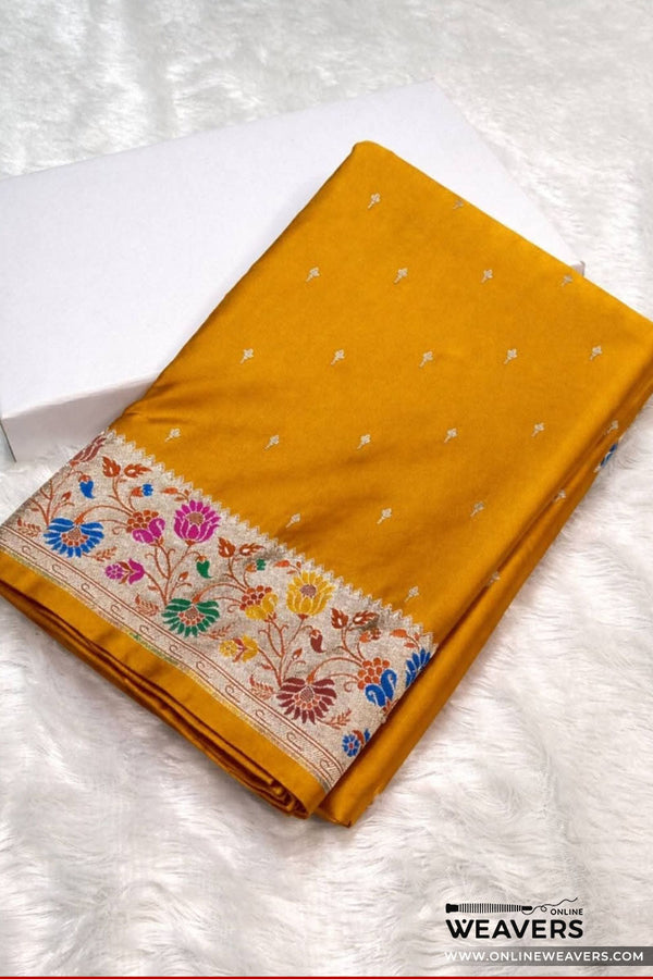 A Mustard Yellow Banarasi Silk Saree with small motifs and 