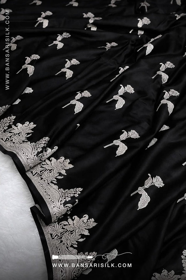 Black fabric with white floral embroidery, featuring the BANSARI logo.