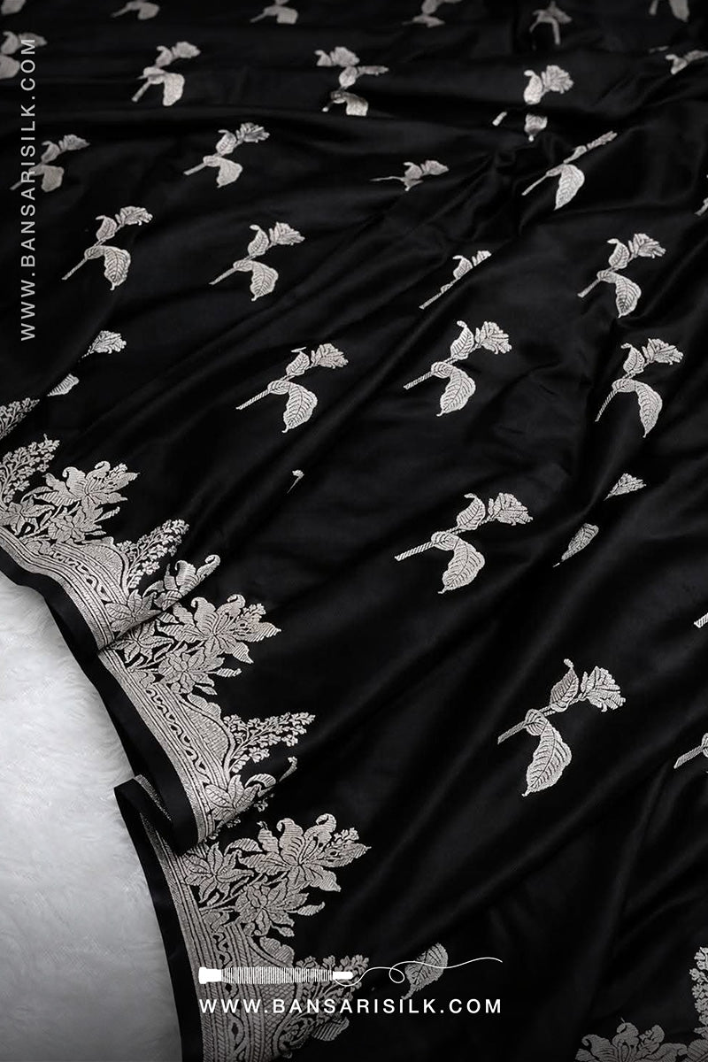 Black fabric with white floral embroidery, featuring the BANSARI logo.