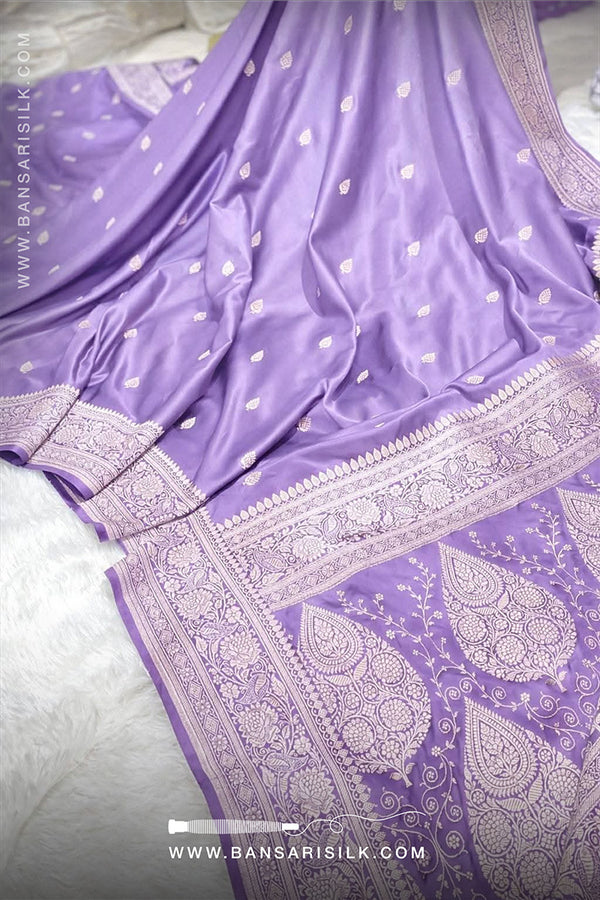 Lilac Purple saree with white patterns on a light gray background